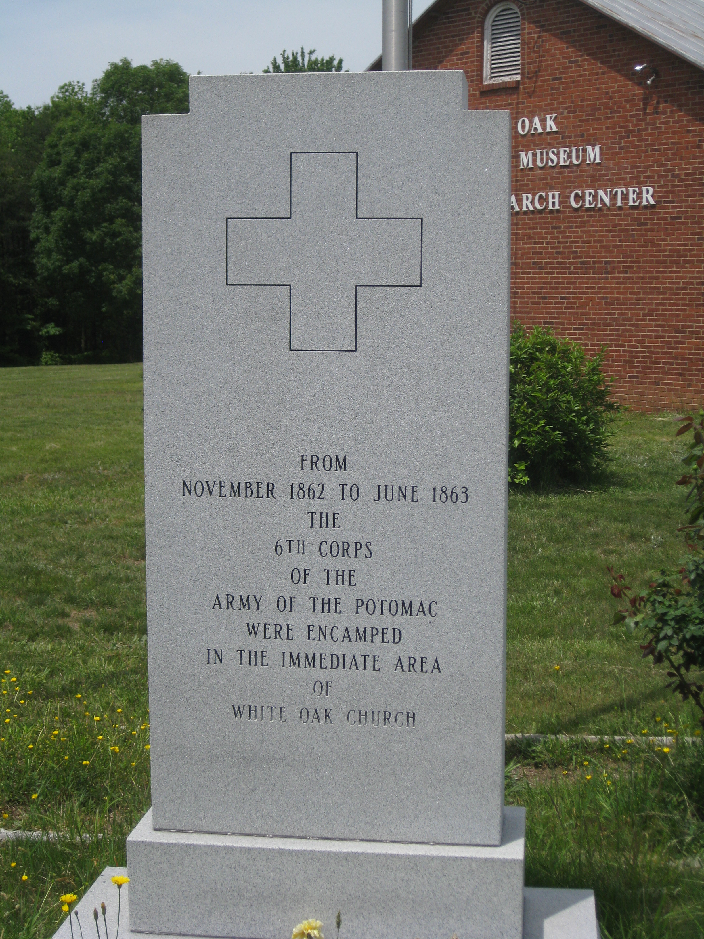 Monument commemorating the encampment of the Sixth Corps, located across the road from the church. In the background is the White Oak Civil War Museum.