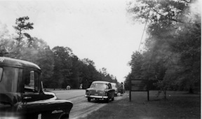 The Jackson Wounding Monument can be seen through the car windshield on the left