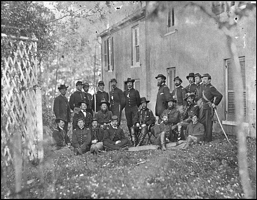 Alfred Pleasonton and his staff. This photograph was taken in October 1863 in Warrenton, Virginia. Pleasonton is seated in the center of the photgraph. George Yates is standing, second from left.