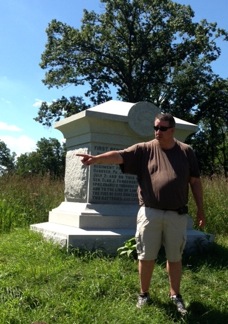 Eric Wittenberg discusses Farnsworth's Charge in front of the monument.