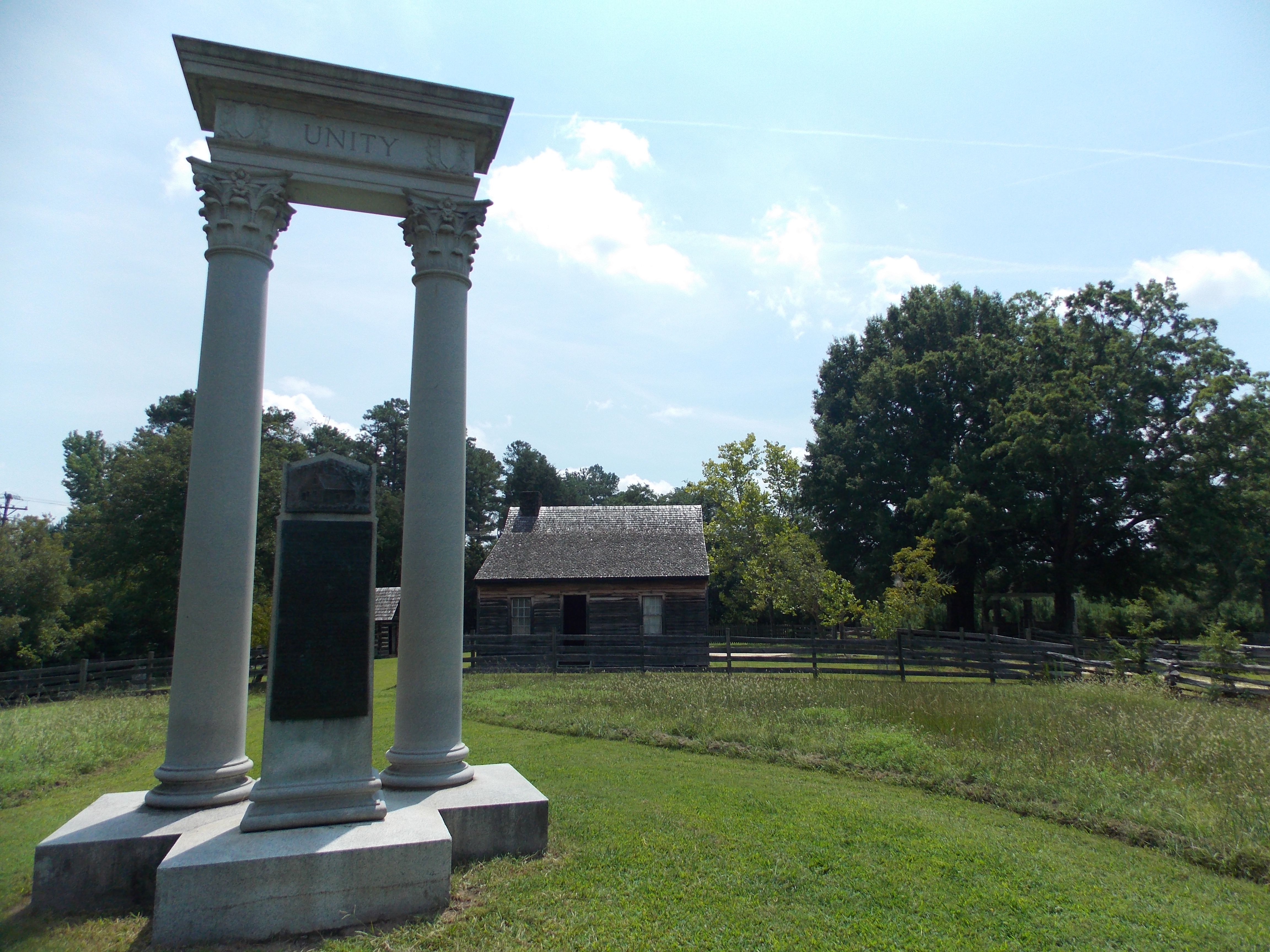 The Unity Monument with the Bennett House (Place) in the background.