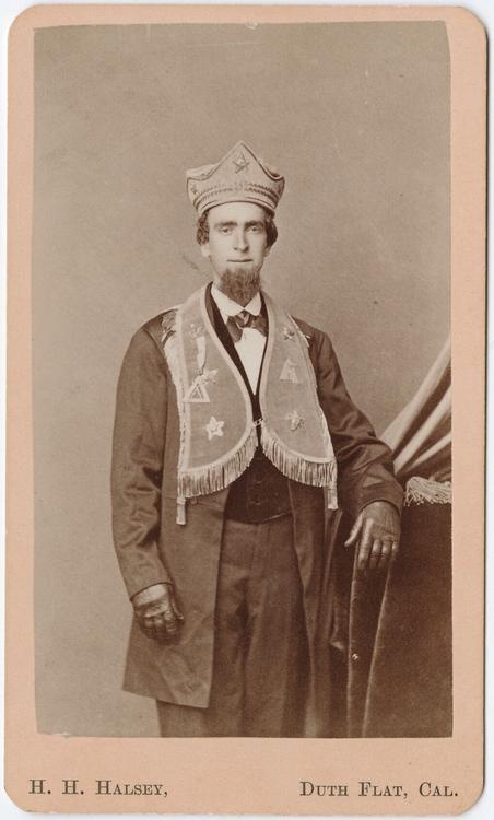 A likely post-war carte de visite showing a man in fraternal costume. The hat is similar in construction, detail and material to the other hats shown prior. Photographed by Henry Halsey in Duth (Dutch) Flats, California. Source unclear.