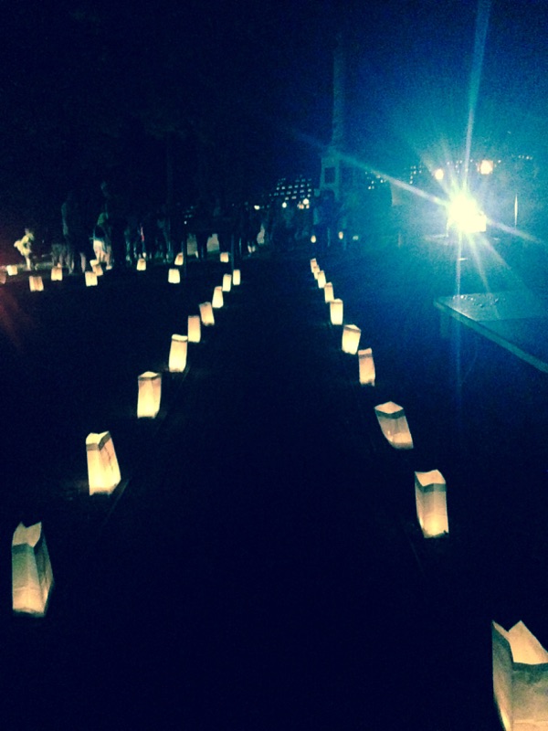 Candles, honoring the soldiers buried in the national cemetery light one of the paths up to where the heroes are buried.