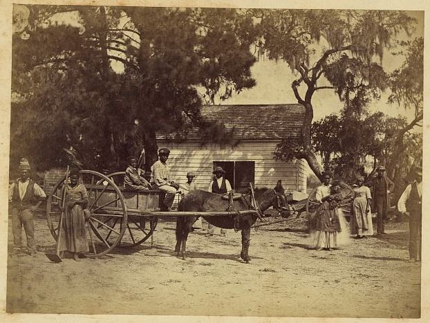 Moore captioned this photograph 'Gwine to da field.' By capturing simple moments like this, he has immortalized a sense of community among a group taking part in the Port Royal experiment.