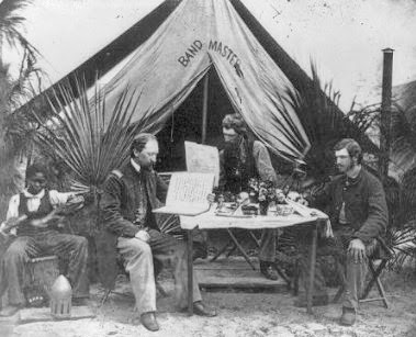 Members of the 3rd New Hampshire Regiment reading outside their tent in Port Royal, S.C.