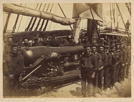 Sailors standing next to a pivot gun on the U.S.S. Pocahontas. The Pocahontas was present at the Battle of Port Royal, and maintained the blockade of South Carolina, Georgia, and Florida. LOC.