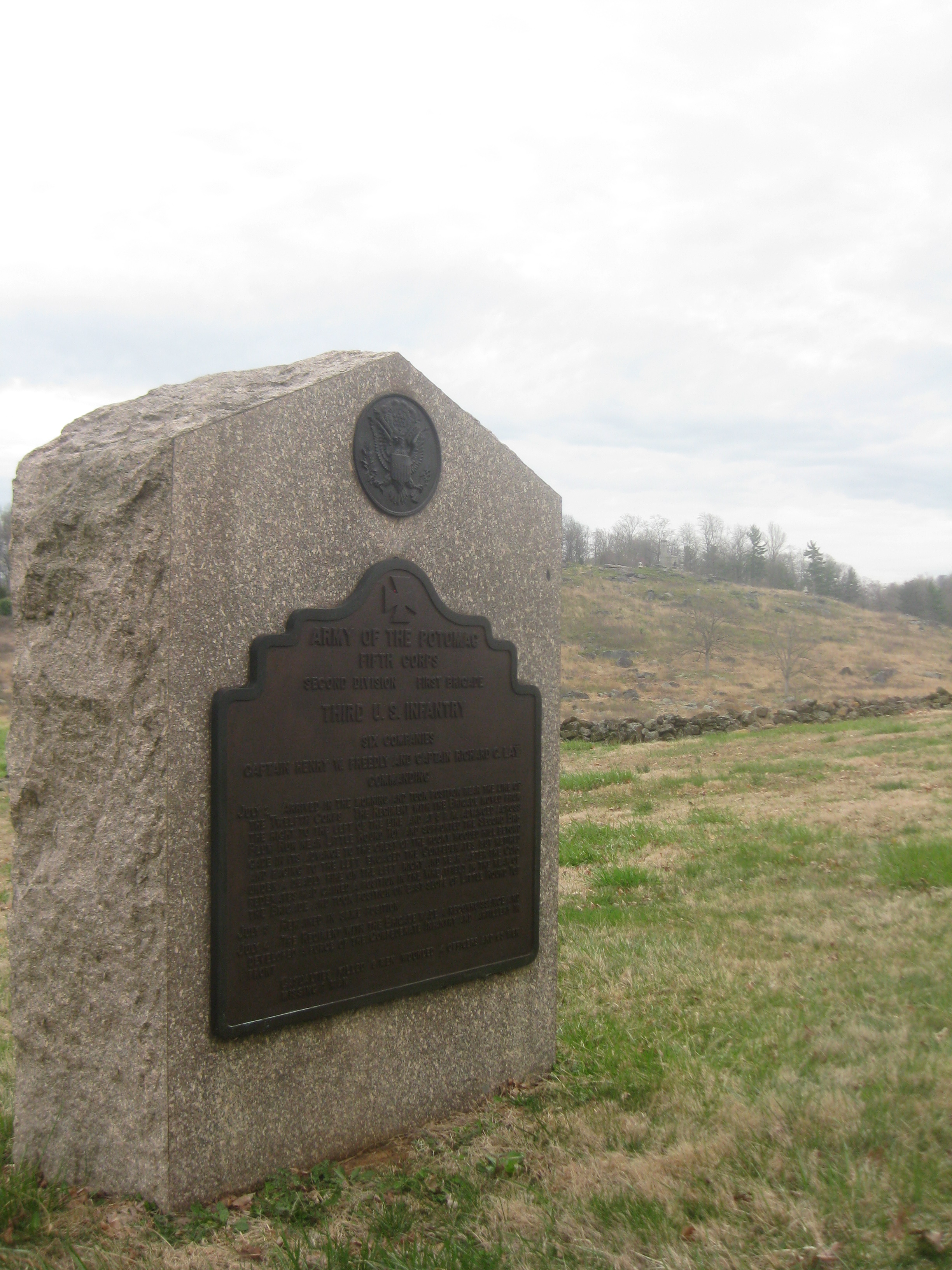 One of several monuments to the U.S. Regulars on Houck's Ridge. Little Round Top can be seen to the right.