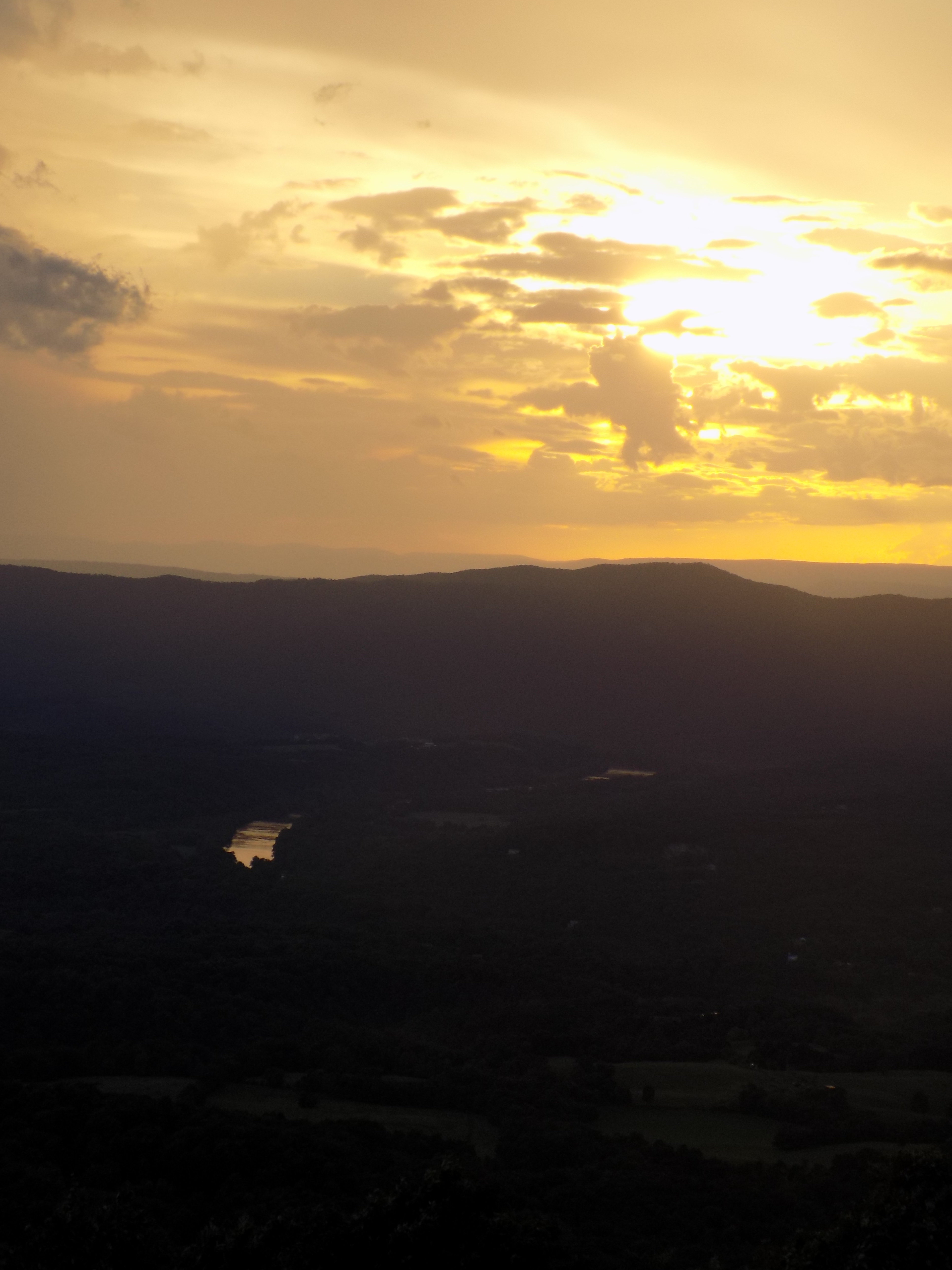 Sunset and Storms in the Valley. Amazing! (Look closely and you'll see part of the Shenandoah River; it looks like a shiny mirror down in the valley.)