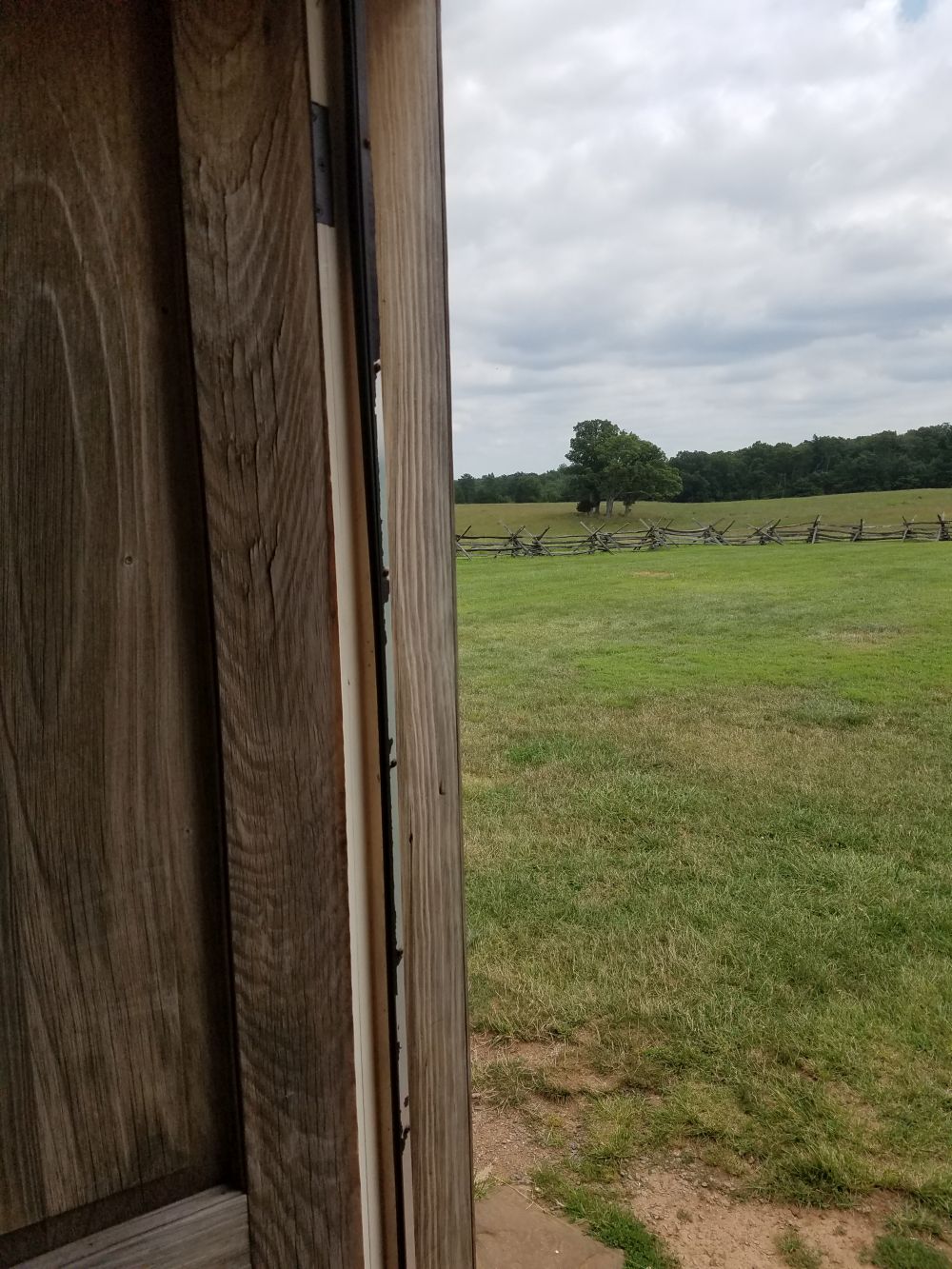 Looking out a doorwar at the Henry House, Manassas Battlefield. Photography by Sarah Kay Bierle, 2016.
