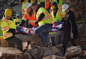 Hill's remains being removed from the monument. (Jay Paul, JPaulPhoto.com)